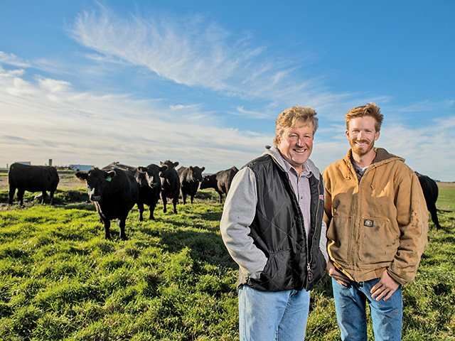 Gary Knutson (left) and son Kyle switched their 120-head herd entirely to grass and hay in 2011. They believe the all-forage diet has improved rumen health. (DTN/Progressive Farmer photo by Greg Latza)